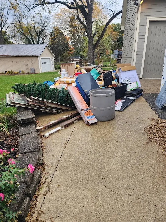 Dumpster being loaded with debris for 10 Yard Dumpster Rental in Taylor Mill